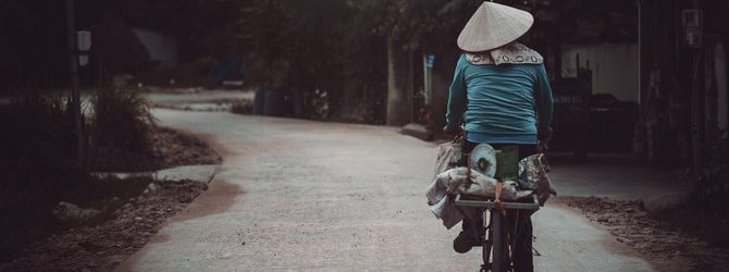Woman riding bike in Vietnam