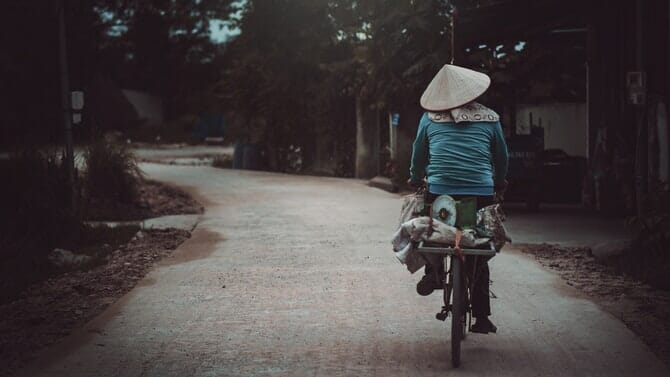Woman riding bike in Vietnam